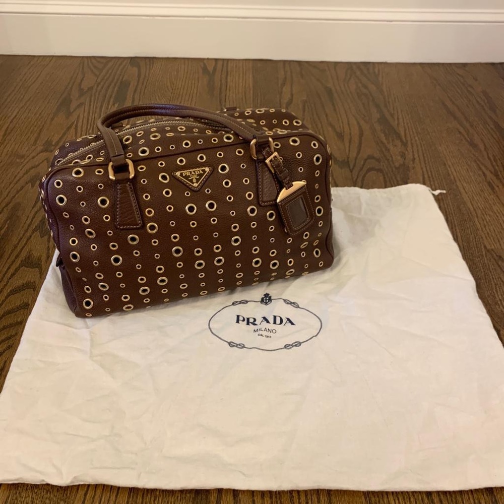 Oversized brown leather PRADA bag with handles and gold detailing